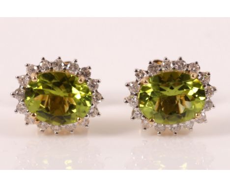 A pair of peridot and diamond cluster ear studs, the oval peridots weighing approx. 4.60cts, within a surround of brilliant c