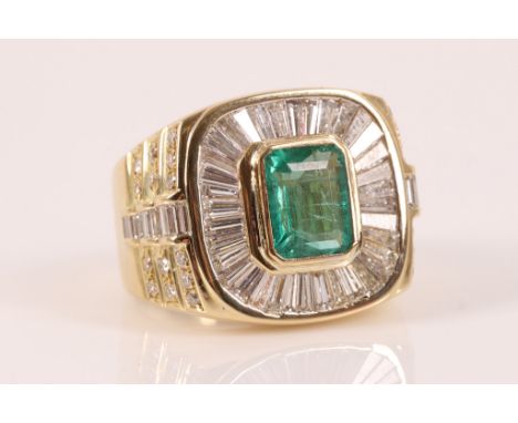 A large emerald and diamond cluster ring, then rectangular shaped cut cornered emerald in a rub over culler with tapered bagu