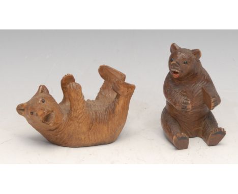 A Black Forest carving, of a bear, 8cm high, c.1900; another (2) 