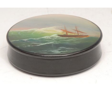 A Russian lacquer circular snuff box, the push-fitting cover painted with a ship on a stormy sea, 6cm diameter, mid-20th cent