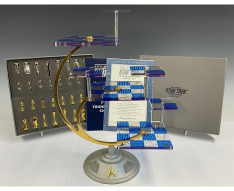 A Franklin Mint Official Star Trek Tridimensional Chess Set, silver plated and gold plated playing pieces, certificate, instr