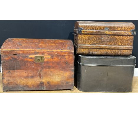 A 19th century pine domed top trunk or chest, 73cm wide over handles; a rounded rectangular black painted trunk, 64cm wide ov