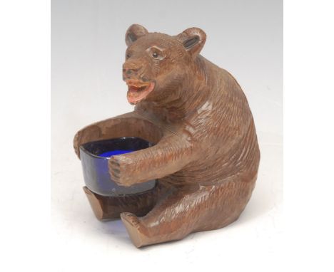 A Black Forest novelty table vesta, carved as a bear, 11cm high 