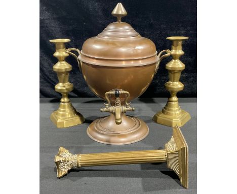 A Victorian copper samovar or tea urn, the handles decorated with foliage, stepped cornice, 34.5cm high; a pair of brass cand