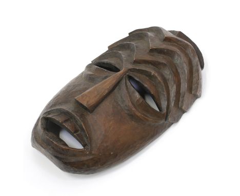 Tribal Art - an African mask, eliptical features, stepped geometric ridges to forehead, 32.5cm long, possibly Songye, Democra