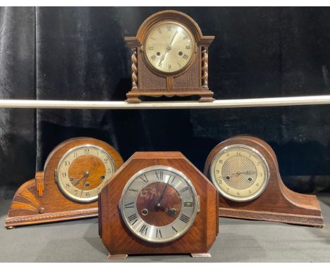 An oak mantel clock, Westminster chime, Arabic numerals, twin winding holes, early 20th century; three other similar oak mant