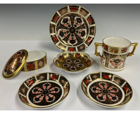 A Royal Crown Derby 1128 Imari pattern oval box and cover, solid gold band, 9cm wide, printed marks in red; a 1128 pattern pe