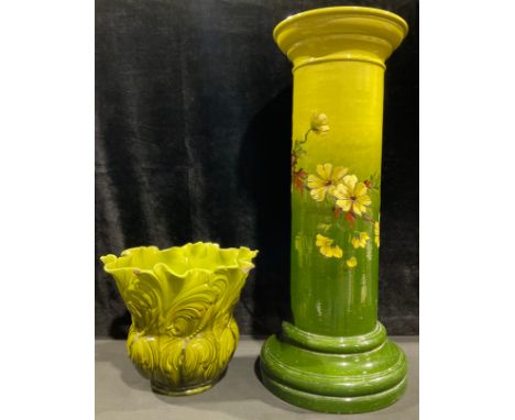A Burmantofts jardiniere pedestal, decorated in the Aesthetic manner, with spiralling floral spray, on graduated green ground