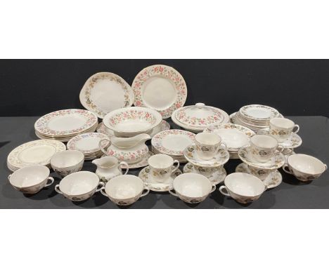 A Royal Doulton Woodland Rose pattern dinner service for six, comprising vegetable dish, serving dishes, dinner plates, desse