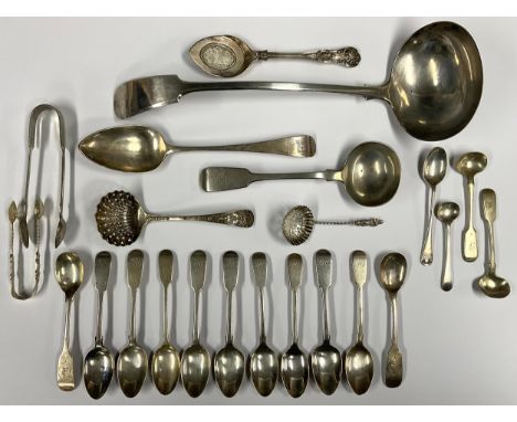 A silver fiddle pattern ladle; a quantity of silver fiddle pattern teaspoons; a silver tea strainer; etc (qty) 