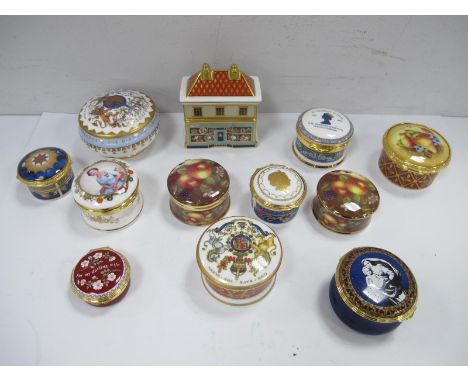 A Royal Crown Derby Paperweight 'The China Shop', Halcyon Days and Spode 'Millenium Celebration' enamel trinket boxes, Royal 