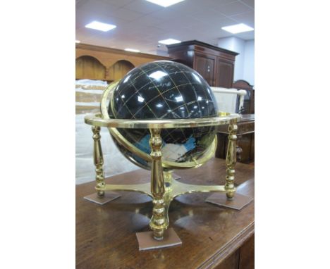 A Large Table Top Specimen Globe, on black ground gilt base, on turned style supports, approximately 45cm.