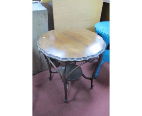 An Early XX Century Mahogany Window Table, with a wavy top, on cabriole legs, bentwood supports, united with under shelf.