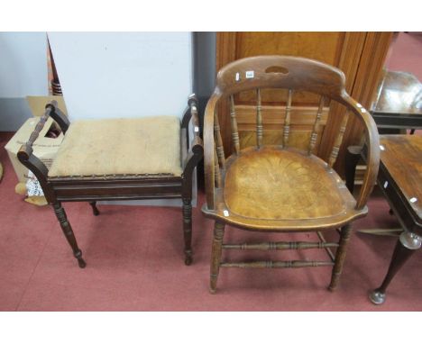 An Early XX Century Oak Office Chair, with a low back, turned supports, solid seat on turned legs, together with an early XX 