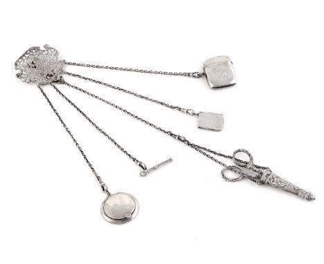 A Victorian silver chatelaine, with cast openwork clip depicting a deity, and five items of dependant equipage, including a c