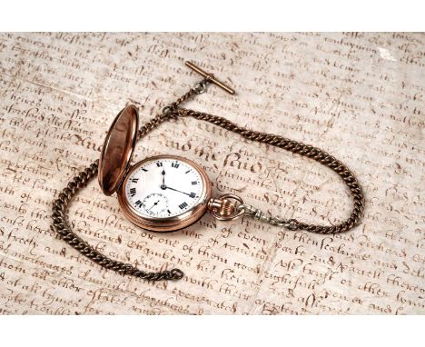 An early 20th Century hunter pocket watch, with white-enamelled face, Roman numerals, and subsidiary seconds dial, in a gold-