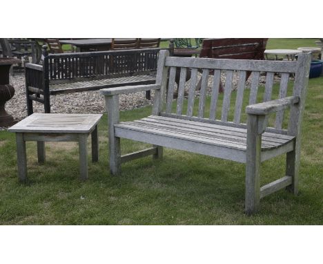 A Barlow Tyrie two seater 'flat arm' garden bench, with slatted seat, 121cm wide, together with a small slatted occasional ta