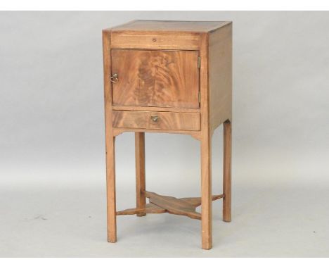 An early 19th century mahogany bedside commode with boxwood stringing, the square top over single door and drawer, on square 