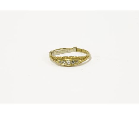 An 18ct gold five stone diamond boat shaped ring, size R½ with ring sizer bar3.28g