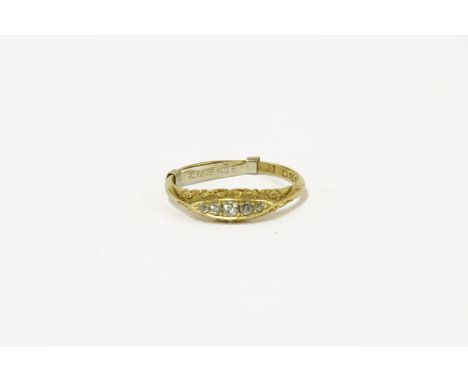 An 18ct gold five stone diamond boat shaped ring, size R½ with ring sizer bar3.28g