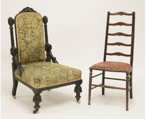 A Victorian carved and ebonised oak salon chair, with pad back and stuff over seat on twinned supports, together with a ladde