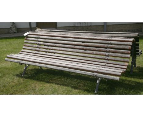 A cast iron park bench, with slatted back and seat, 200cm long