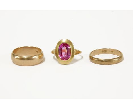 A Russian gold single stone synthetic sapphire ring, marked 583 Zolotnik, and two Russian gold  wedding rings, marked 375 Zol