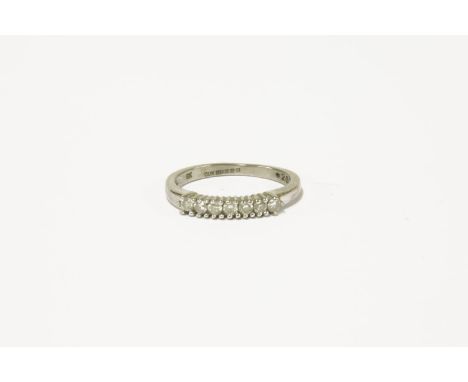 A 9ct white gold seven stone diamond half hoop ring, size K½1.97g