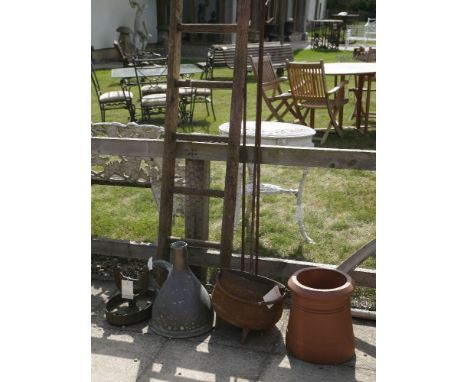 A 19th century cast iron boot scraper, together with a terracotta chimney pot, a large copper jug, a cast iron cauldron (af) 