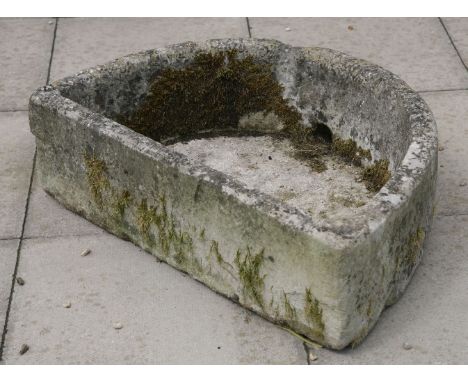 A carved limestone stone d-shaped basin, 69cm wide