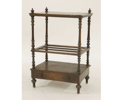 A Victorian walnut canterbury with shelf above