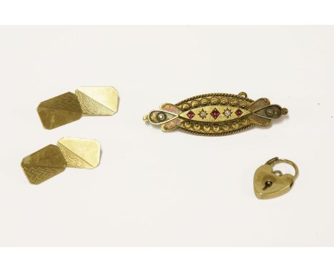 A Victorian Etruscan 15ct gold ruby and diamond brooch, a gold padlock marked 9ct and a pair of 9ct gold cufflinks, with engi