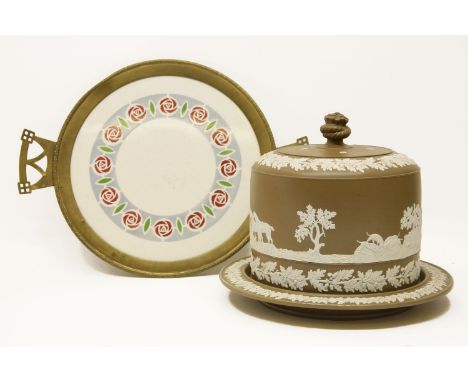 A large brown glazed cheese dish and cover, the sprigged decoration depicting hunting scenes, marked for the underside 'S * S