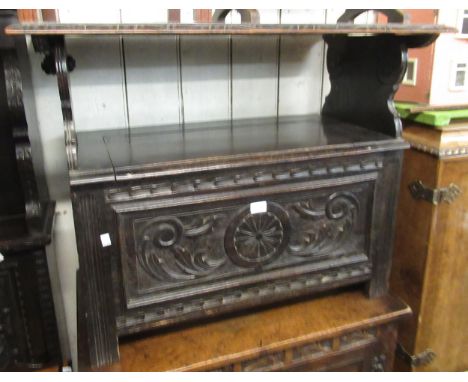 Late 19th Century / early 20th Century carved oak monks bench with a fold-over top and box base, 91cm wide 