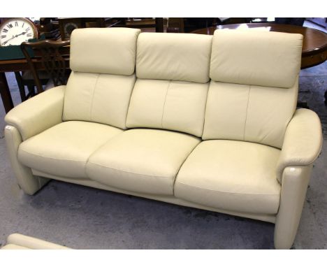 Modern cream leather three seater sofa and a matching foot stool 