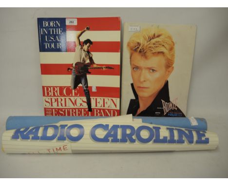 David Bowie 1983 tour brochure, together with a Bruce Springsteen 1985 brochure with ticket and a Radio Caroline 1984 poster 