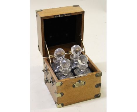 Late 19th / early 20th Century oak silver plate mounted four bottle perfume decanter box with cut glass bottles and side carr