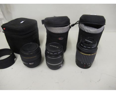 Three various 35mm camera lenses by Tamron, Canon and Sigma 