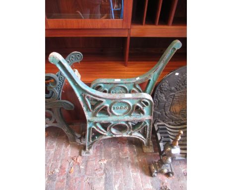 Pair of 1993 cast iron green painted bench ends, pair of similar with centre arm rest, and another pair of smaller modern cas