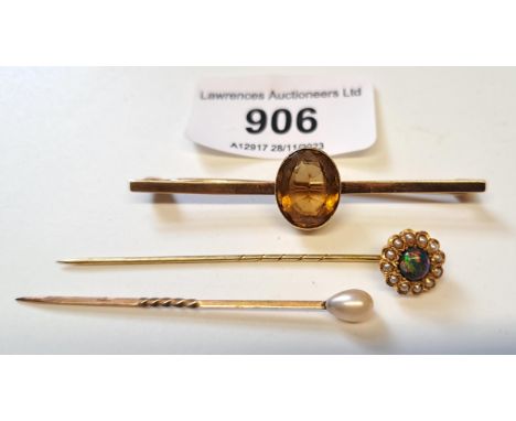 Victorian black opal and seed pearl set stick pin, cultured pearl stick pin and a gold smoky quartz set bar brooch 