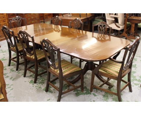 Late 19th / early 20th Century mahogany twin pedestal dining table, the tilt tops above gun barrel turned supports and reeded