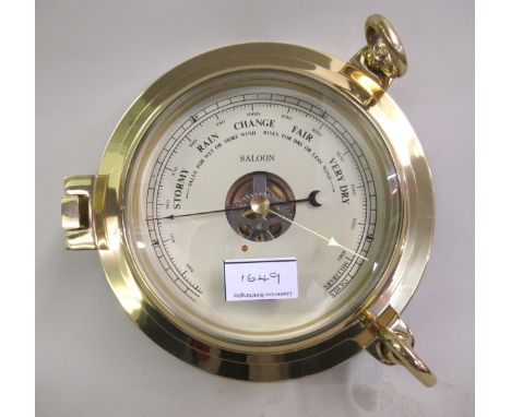 20th Century brass cased ship style barometer and ship style clock in original boxes, 24cm diameter 