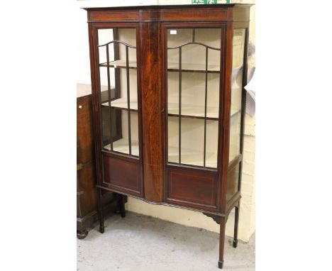 Edwardian mahogany and line inlaid display cabinet with two bar glazed and panel doors enclosing shelves, on square tapering 