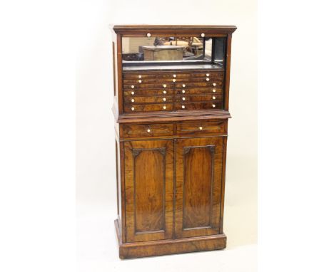 Good quality Victorian figured walnut dentist cabinet, the tambour top enclosing shelf and multiple small drawers with turned