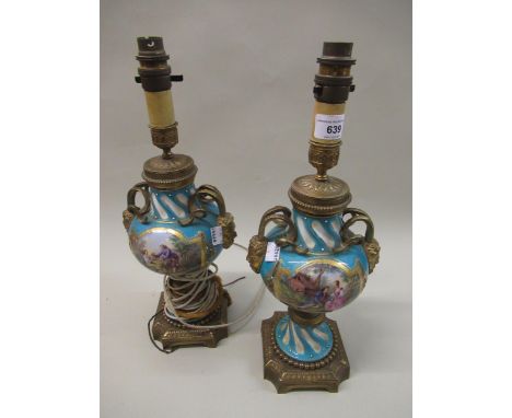 Pair of late 19th / early 20th Century French Sevres style ormolu mounted porcelain table lamps, painted with panels of figur