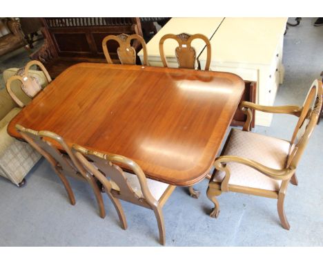 Good quality reproduction mahogany and crossbanded D-end dining table, raised on carved fluted supports with tripod bases and