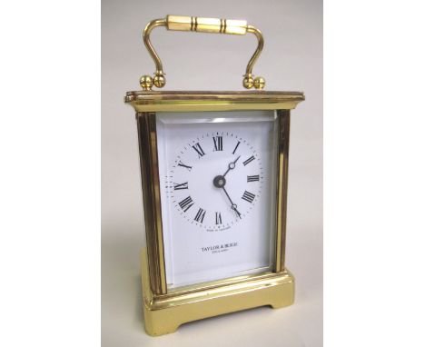 Small 20th Century gilt brass cased carriage clock, the enamel dial with Roman numerals signed Taylor & Bligh, England, 11cm 