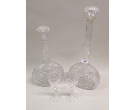 Early 20th Century cut glass decanter with tall narrow neck and mushroom stopper, 41cm high together with a similar, smaller 