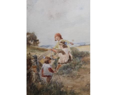 Early 20th Century English school, watercolour, three girls climbing on a five bar gate in a coastal landscape, signed Paters