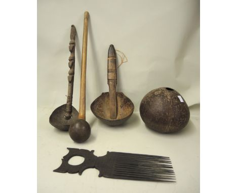 Small quantity of African and Papua New Guinea tribal wooden artefacts including two coconut cups, gourd, comb, etc. 
